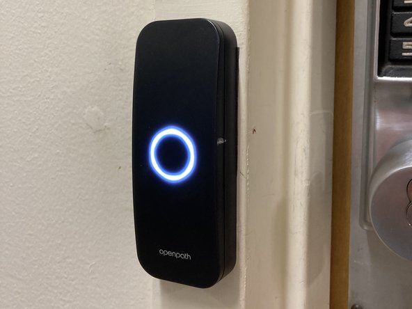 Once activated, the OpenPath Smart Reader will show a white circular light, and the lock will click when it opens.