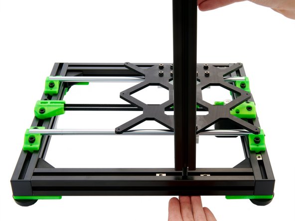 Place your z-extrusion over the hole in the y-extrusion and fix it from below with a M8x40mm Hexagon Socket Head Cap Screw.