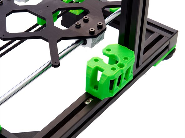 Slide a corner bracket into the rear slot of the z-extrusion.