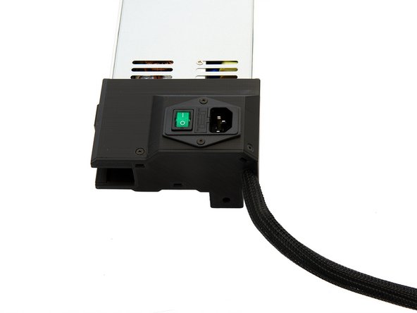 Now push the PSU cables through the Techflex tube. Push the tube about 1cm into the power supply.