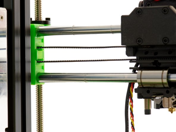 Slide the xy-belt tensioner insert into the y-Idler.