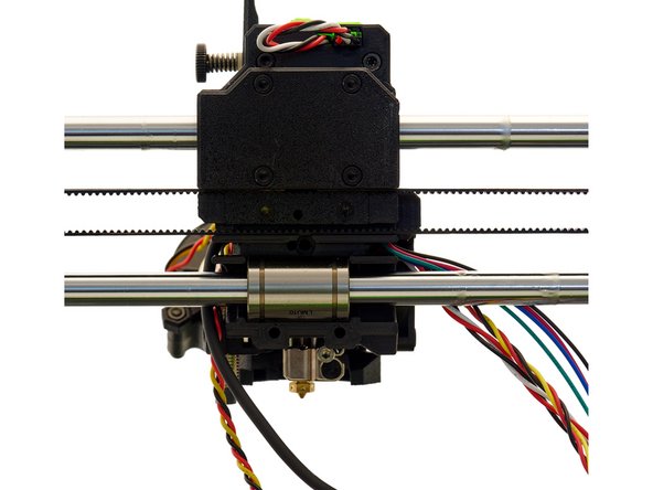 Insert the pointed end of the nylon filament into the left hole in the center of the x-carriage.
