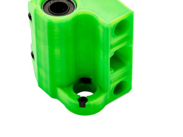 Check the hole for the POM nut for filament protrusions and remove them with a knife or scalpel if necessary.