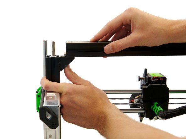 Make sure that the large holes in the x-extrusion are pointing up and the small holes are pointing down.