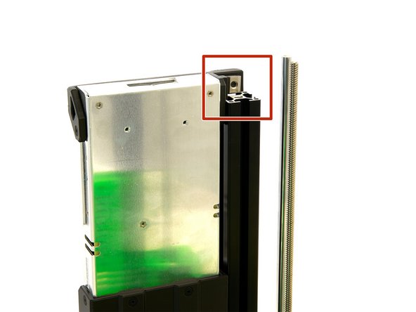 The power supply unit is attached to the right side of the printer using the T-Nut that was just attached. The T-Nut is then pushed into the right slot of the right z-extrusion.