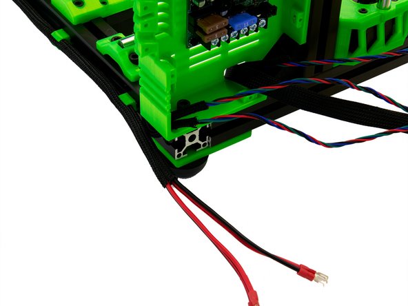 Press the Techflex tube with the PSU cables into the cable clips already attached to the back of the x-extrusion.