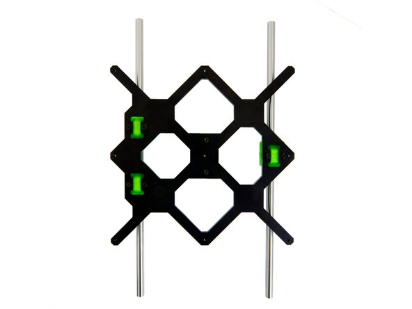 Carefully slide the 2x y-rods through the three bushings and place them on the y-rod holders.