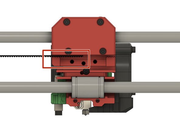 Insert one end of the belt on side into the x-carriage. It should be inserted half way into the x-carriage.