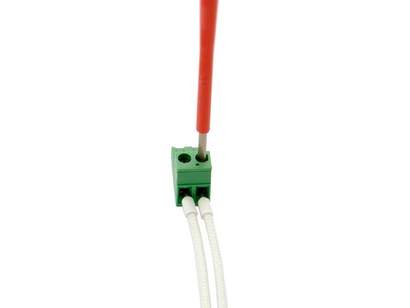Push each of the two cable ends of the thermistor cartridge into one opening and secure them.