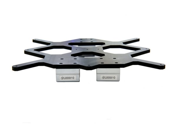 Position the three greased bushings under the holes in the y-slide.