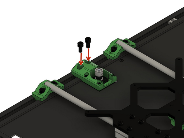 Befestigen Sie die zusammengebaute y-Motorhalterung an den 2x Nutensteinen zwischen den beiden y-Wellenhalterungen lose in der hinteren x-Achse. Nutzen Sie hierfür 2x M6x12mm Zylinderkopfschrauben.