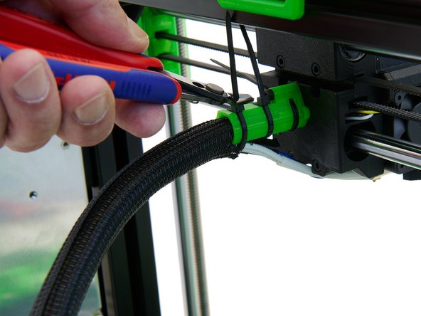 Secure the cables in the x-cable holder with 3x Zip Ties.