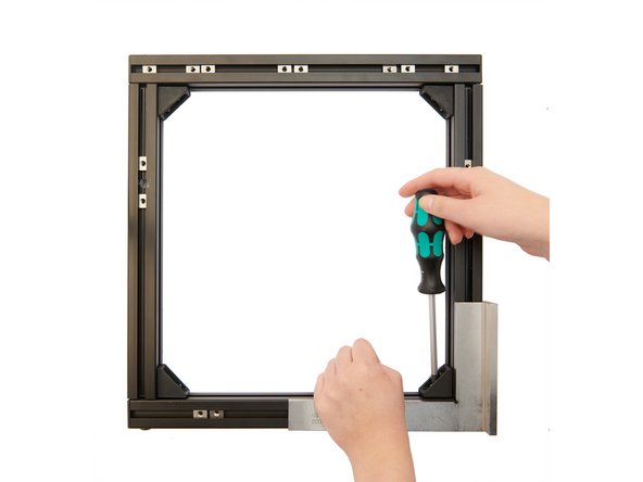 Use a try square to ensure that in one of the four corners the two extrusions are at a 90° angle to each other.