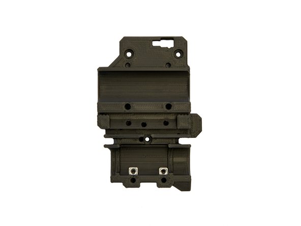 Insert 2x M3 Square Nuts into the bottom of the front of the x-carriage.