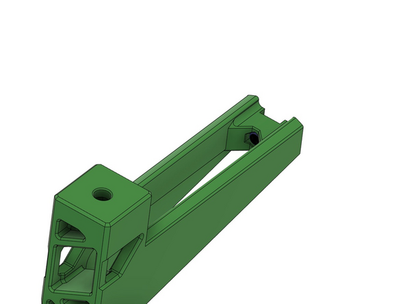 Stecken Sie eine selbstsichernde Mutter mithilfe einer Reißnadel,  in das vorgesehene Loch im Spulenhalter.