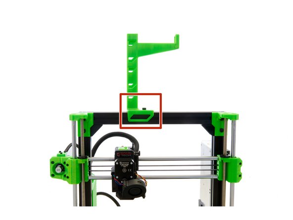 Place the assembled spoolholder on the upper x-axis and align the T-Nut so that the T-Nut sits underneath the hole in the spool holder.