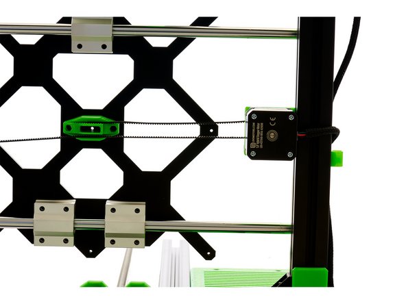 Benutzen Sie einen Schlitzschraubendreher, um den Riemen vorsichtig einzudrücken, da der Riemenhalter bei erhöhtem Druck brechen kann.
