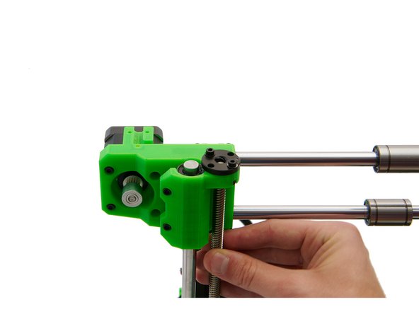 Turn both spindles of the z-stepper motors at the same time to move the x-axis slightly downwards.