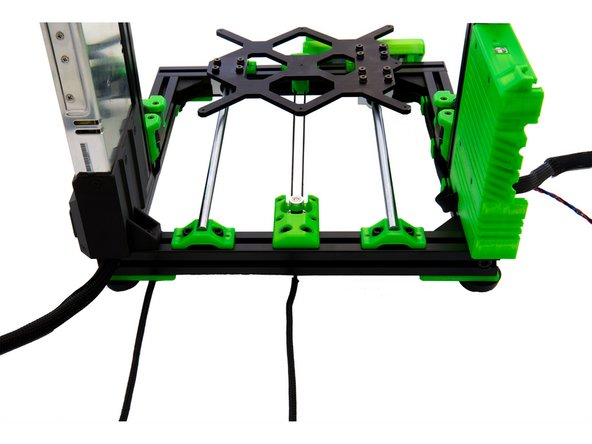 Pull the cable of the right z-stepper motor past the L-bracket, through the rear slot of the rear x-extrusion, and into the Einsy box.