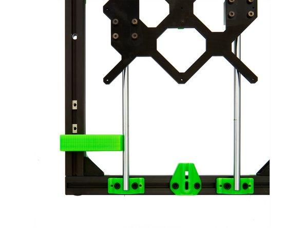Now place the 10mm y-calibration tool at the front of the left y-axis of the frame and press the rod against it.