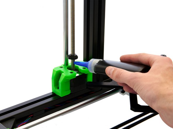 At the very bottom, put a drop of Screw Lock on the spindle and turn the z-screw cover above it. A gap of 1mm should remain between the bottom of the z-screw cover and the top of the motor.