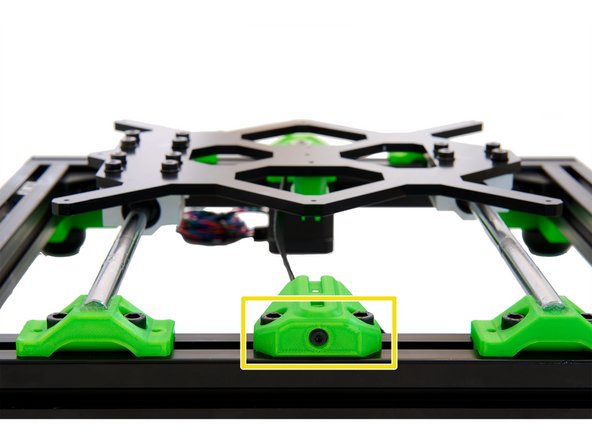 Insert a M3 washer into the front hole in the belt tensioner and push a M3x18mm cylinder head bolt through . Screw the bolt in until the xy belt tensioner insert is reached and 1-2 turns are in the self-locking nut.