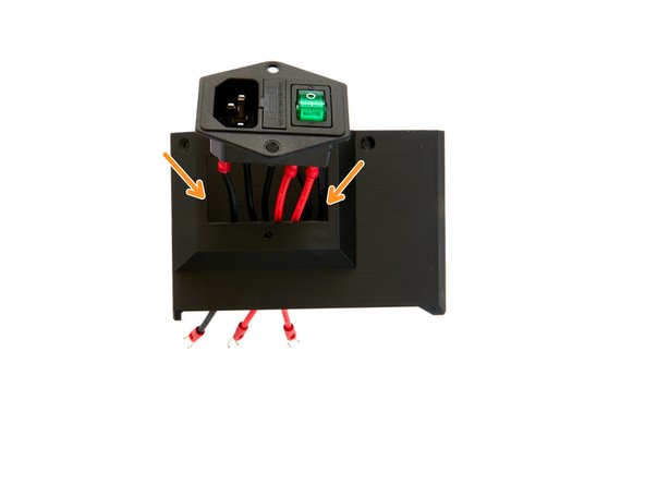 From the outside, push the cables of the PSU switch into the Meanwell cover.