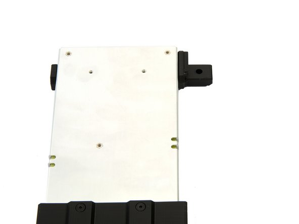 A M6x12mm cylinder head screw is inserted through the hole in the bracket.