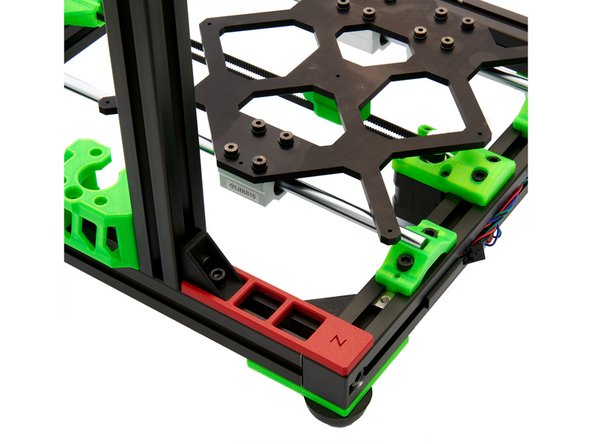 Position the 2x T-Nuts on the y-extrusion under the opening of the z-motor mount and under the hole in the corner bracket.