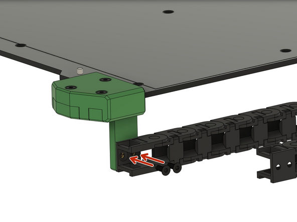 Sichern Sie die Kette an der Unterseite der Heizbettabdeckung mit 2x M3x8mm Senkkopfschrauben.