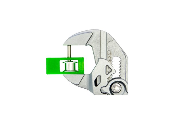 Now, place a toothless pulley onto the pin. Continue to push the dowel pin through until it reaches the end of the toothless pulley.