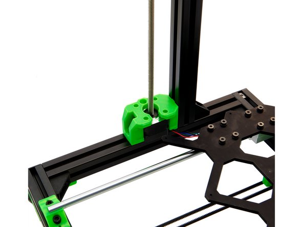 Place the z-stepper motor next to the z-motorholder. The cable should be aligned towards the rear of the frame.