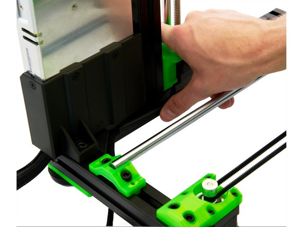 Press the cables of the right z-stepper motor into the left slot of the right y-extrusion and cover the cable with the slot cover.