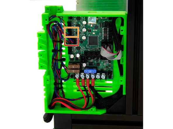 Pull three motor cables to the left side of the Einsy Box and fasten them to the cable holder with zip ties.