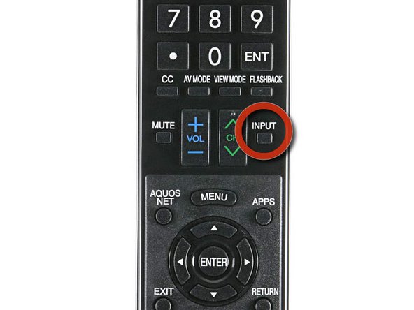 Press the INPUT button on the Sharp Aquos remote until you reach the TABLE PC input on the television.