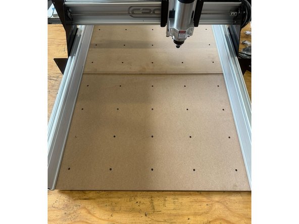 Slide the waste board(s) onto the aluminium profiles as shown in the pictures.  Do not tighten these screws at this stage.