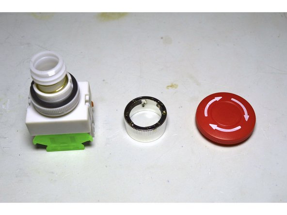 Disassemble the Emergency Stop Plug as shown in the picture