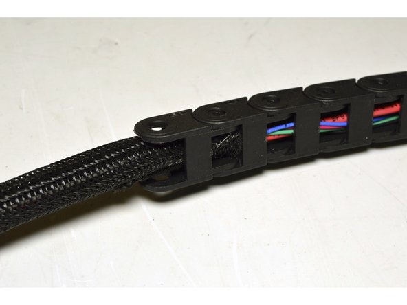 Push the webbing into the Drag Chain for 2 to 3 links