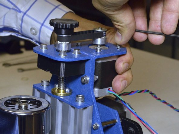 Tighten the GT2 belt by pulling the motor with the one hand while tightening the M3x8 screws with the other hand