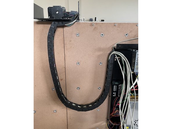 Close the links of the drag chain by pressing them closed one by one.  Make sure all the wires from the Right Gantry runs inside the drag chain.