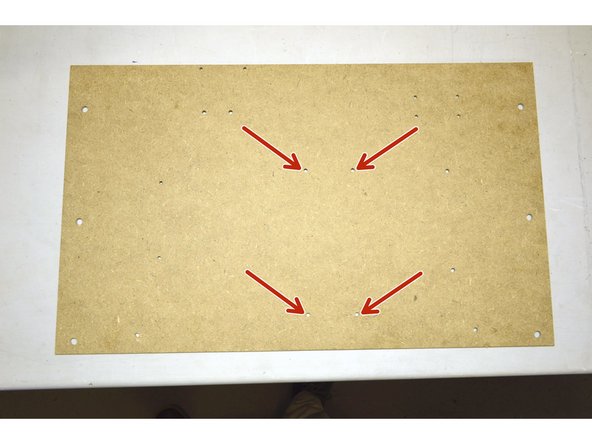Mount the 400W Power supply to the electronics board through the 4 holes as shown in red on the picture.