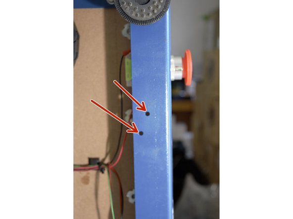 Mount the toggle switch assembly onto the bottom of the front plate of the CNC machine as shown
