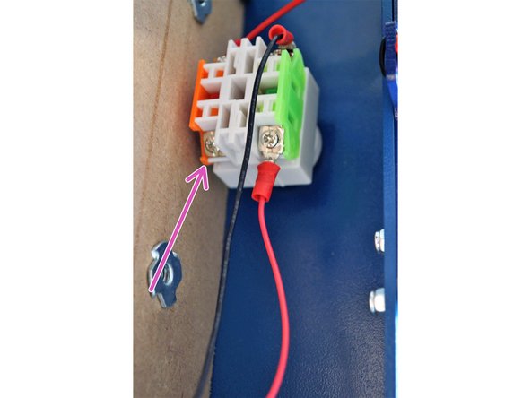 Connect the 12V E-Stop cable to the orange side (normally Closed) on the E-Stop as shown