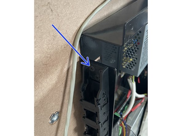 The drag chain can only be fastened in one orientation due to the spacing of the holes.  So if the 3 holes in the drag chain does not line up with the holes in the steel plate, flip the drag chain around.