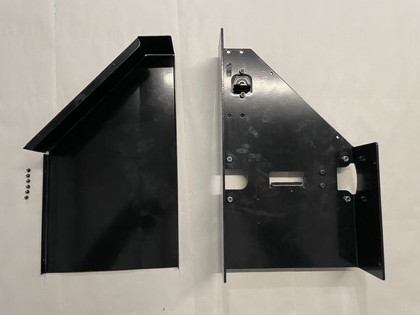 Remove the cover from the left gantry by unscrewing the 6 screws as shown in the pictures with the philips screw driver