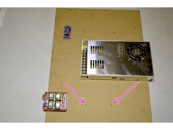 Mount the 100W power supply through the holes indicated in pink.