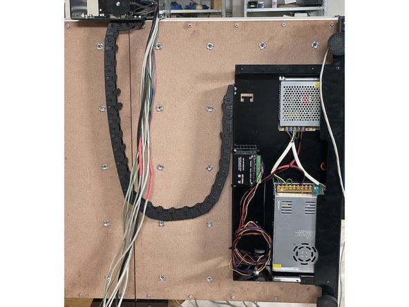 Mount the other side of the drag chain to the Electronics Assembly with 3 x M4x12 Counter Sunk Screws and 3 x M4 Lock Nuts.