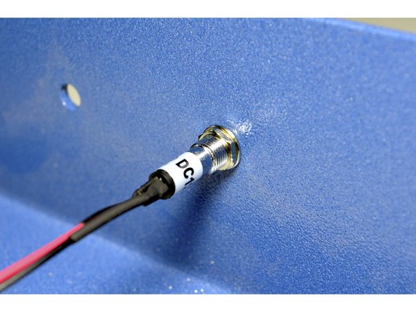 Pull the wires od the LED through the hole provided