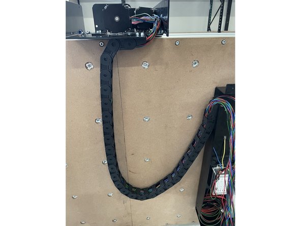 Close the links of the drag chain by pressing them closed one by one.  Make sure all the wires from the Right Gantry runs inside the drag chain.