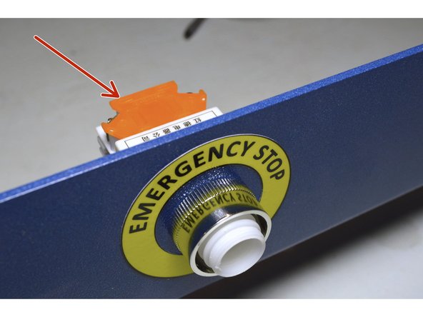Mount the back end of the plug to the front panel with the orange plate to the top as shown
